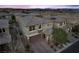 Aerial view of a modern home with a brick driveway, a two-car garage, and well-kept landscaping at 888 Cherry Glen Pl, Las Vegas, NV 89138