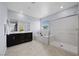Spacious primary bathroom featuring a double vanity, soaking tub, and glass-enclosed shower for a spa-like experience at 888 Cherry Glen Pl, Las Vegas, NV 89138