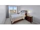 Cozy bedroom with a large window, comfortable bed, and matching nightstands with lamps at 888 Cherry Glen Pl, Las Vegas, NV 89138