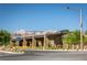Modern stone entrance structure with desert landscaping, a street sign, and a mountain view at 888 Cherry Glen Pl, Las Vegas, NV 89138