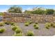 A stone sign for Stonebridge Park, complemented by desert foliage and a decorative gravel bed at 888 Cherry Glen Pl, Las Vegas, NV 89138