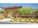 Stone community entrance with modern architectural details, landscaping, and neighborhood signage at 888 Cherry Glen Pl, Las Vegas, NV 89138