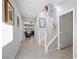 Bright hallway with staircase leading to the upper level, showcasing contemporary decor and neutral tones at 888 Cherry Glen Pl, Las Vegas, NV 89138