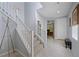 Hallway view featuring staircase, modern decor, and seamless access to various rooms in the home at 888 Cherry Glen Pl, Las Vegas, NV 89138