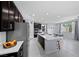 Spacious kitchen with stainless steel appliances, island seating, dark cabinets, and ample counter space at 888 Cherry Glen Pl, Las Vegas, NV 89138