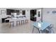 Modern kitchen featuring a large island, stainless steel appliances, and dark cabinetry for a sleek, contemporary design at 888 Cherry Glen Pl, Las Vegas, NV 89138