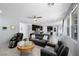 Open-concept living area with modern furnishings, connecting the kitchen and dining for seamless entertaining at 888 Cherry Glen Pl, Las Vegas, NV 89138
