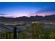 Scenic night view overlooking the cityscape with mountains silhouetted against the twilight sky at 888 Cherry Glen Pl, Las Vegas, NV 89138