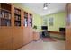 Bright home office featuring custom built-ins, a spacious desk, and ample natural light for productivity at 888 Cherry Glen Pl, Las Vegas, NV 89138