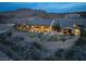 Breathtaking aerial view of a desert estate highlighting the outdoor living areas and beautiful mountain views at 1123 Christian Rd, Henderson, NV 89002