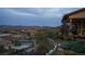 Beautiful backyard with mountain views, curved glass fence, and lush landscaping at 1123 Christian Rd, Henderson, NV 89002
