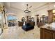 Lavish bathroom boasts dual vanities, seating area, and gym equipment in the background at 1123 Christian Rd, Henderson, NV 89002