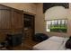 Comfortable bedroom featuring a large window with views and a gaming console at 1123 Christian Rd, Henderson, NV 89002