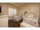 Bright bedroom featuring two single beds and hardwood flooring at 1123 Christian Rd, Henderson, NV 89002