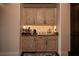 Custom butler's pantry featuring granite countertops, patterned backsplash, and ample cabinet storage at 1123 Christian Rd, Henderson, NV 89002