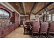 Dining area featuring a long table with seating for twelve, chandelier, and nearby kitchen features at 1123 Christian Rd, Henderson, NV 89002