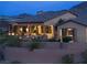 Inviting exterior of a luxury home with a covered patio, pool, and landscaped terrace at 1123 Christian Rd, Henderson, NV 89002
