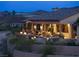 Luxury home exterior featuring an inviting outdoor living space with a pool and desert landscaping at 1123 Christian Rd, Henderson, NV 89002