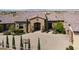 Elegant stone-accented entrance with a paved driveway and landscaped greenery, creating a welcoming approach at 1123 Christian Rd, Henderson, NV 89002