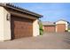 Spacious garages with wooden doors and a paved driveway, blending functionality with curb appeal at 1123 Christian Rd, Henderson, NV 89002