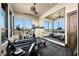 Home gym with exercise equipment, large windows and mirrors at 1123 Christian Rd, Henderson, NV 89002