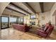 Spacious living room features a fireplace, exposed beams, and oversized windows with a mountain view at 1123 Christian Rd, Henderson, NV 89002