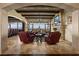 Elegant living room featuring a stone fireplace, comfortable seating, and panoramic views at 1123 Christian Rd, Henderson, NV 89002