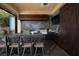 Outdoor kitchen with a bar and a grill, perfect for entertaining at 1123 Christian Rd, Henderson, NV 89002