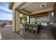 Stylish outdoor kitchen with barstool seating and desert views at 1123 Christian Rd, Henderson, NV 89002