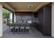 Outdoor kitchen with stainless steel appliances and bar stool seating at 1123 Christian Rd, Henderson, NV 89002