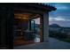 Modern outdoor kitchen with granite countertops, dark cabinets, and stainless steel appliances at 1123 Christian Rd, Henderson, NV 89002