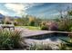 Poolside with desert landscape and water feature at 1123 Christian Rd, Henderson, NV 89002