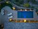 Aerial shot showcasing a modern rectangular pool with lounge chairs and a cozy fire pit area at 1123 Christian Rd, Henderson, NV 89002