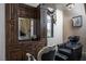 Salon station with leather chairs and dark wood cabinets at 1123 Christian Rd, Henderson, NV 89002