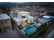 Aerial view showcasing a backyard oasis complete with a pool, spa, and outdoor lounge area at 11990 Montague St, Las Vegas, NV 89138