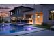 Backyard with a pool, spa, and outdoor kitchen creating the perfect space for entertaining guests at 11990 Montague St, Las Vegas, NV 89138