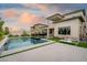 Spacious backyard featuring a pool, spa, outdoor seating, and a built-in BBQ area at 11990 Montague St, Las Vegas, NV 89138