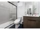 Bathroom with glass-enclosed shower, modern fixtures, and vanity with storage at 11990 Montague St, Las Vegas, NV 89138