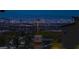 Panoramic city lights at night, offering a spectacular view from this elevated neighborhood at 11990 Montague St, Las Vegas, NV 89138