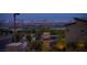 Beautiful exterior view showcasing the Las Vegas city skyline with a community pool and desert landscaping at 11990 Montague St, Las Vegas, NV 89138