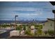 Beautiful exterior view showcasing the Las Vegas city skyline with a community pool and desert landscaping at 11990 Montague St, Las Vegas, NV 89138