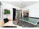 Bright game room with ping pong table, stylish decor and a comfortable seating area at 11990 Montague St, Las Vegas, NV 89138