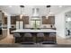Spacious kitchen featuring an island, stainless hood, and seating area at 11990 Montague St, Las Vegas, NV 89138
