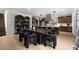 Modern kitchen boasts a large island, sleek cabinets, and stainless steel appliances at 11990 Montague St, Las Vegas, NV 89138