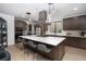 Bright kitchen with island, breakfast bar, and stainless steel appliances at 11990 Montague St, Las Vegas, NV 89138