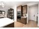 Eat-in kitchen features custom cabinetry, stainless steel appliances, and wood floors at 11990 Montague St, Las Vegas, NV 89138