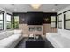 Sleek living room featuring a fireplace, modern lighting, and comfortable sofas, perfect for relaxing and entertaining at 11990 Montague St, Las Vegas, NV 89138