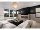 Inviting living room features fireplace, modern lighting, and comfortable sectional seating at 11990 Montague St, Las Vegas, NV 89138