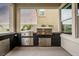 Modern outdoor kitchen with stainless steel appliances and ample counter space for entertaining at 11990 Montague St, Las Vegas, NV 89138