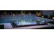 Beautiful pool and spa with diamond patterned wall and lush landscaping create a backyard oasis at 11990 Montague St, Las Vegas, NV 89138